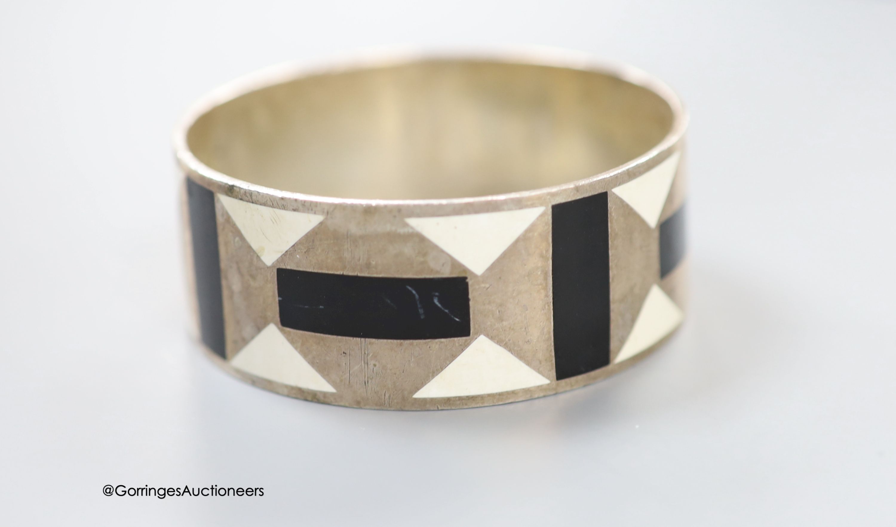 A modern Paloma Picasso for Tiffany & Co 925 and two colour enamel bangle, interior diameter approx. 62mm, gross weight 72.9 grams (a.f.).